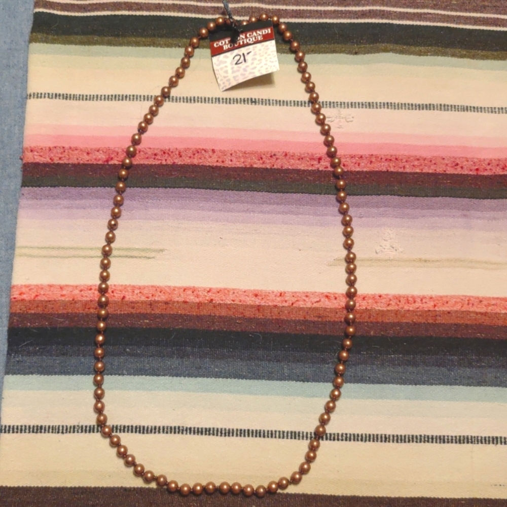 Beautiful boutique bronze beaded necklace.